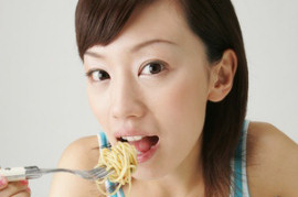 Lady Eating and Getting Bad Breath